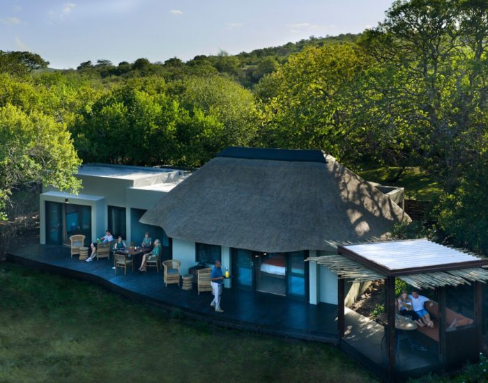 South-Africa-Phinda-Zuka-Lodge-Family-Suite-exterior-with-family-and-butler-