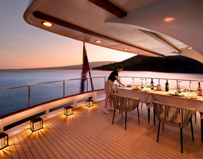 South-America-Ecuador-Galapagos-Islands-Galapagos-Explorer-out-door-dining-evening-crew-