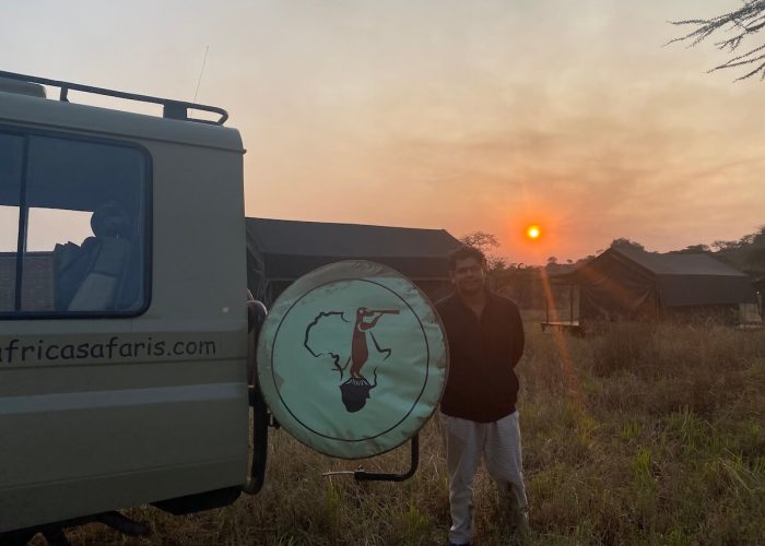 Sunset serengeti with a safari jeep