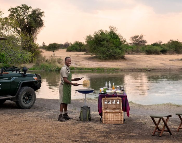 Tanzania-Grumeti-Serengeti-River-Lodge-Experiences-safari-game-drive-rangers-breakfast-1-Website-1920x1080-fill-gravit