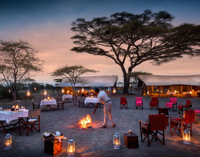 Tanzania-Serengeti-Under-Canvas-SUC-Guest-Area-boma-at-night-with-lanterns_Website-1920x1080-fill-grav