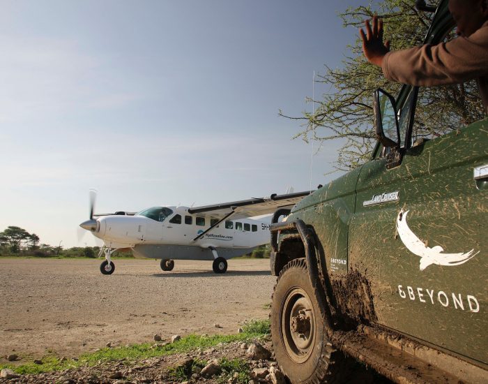Tanzania-Serengeti-Under-Canvas-SUC-branded-vehicle-and-plane-