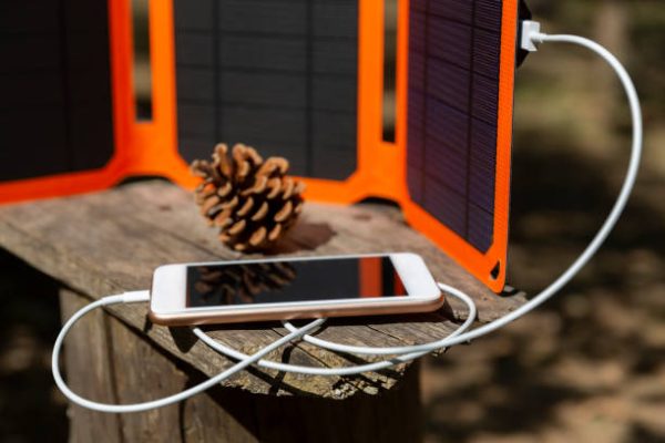 A phone charging via solar or remote lodge with generator